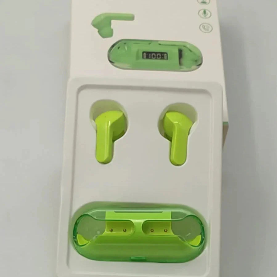 Green earbuds in a white packaging with a USB cable on a gray background