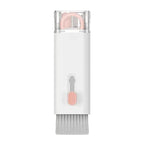 White cleaning tool with pink head on a white background